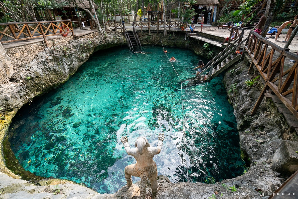 Cenote Car Wash — shallow cenote with lily pads and crystal-clear water