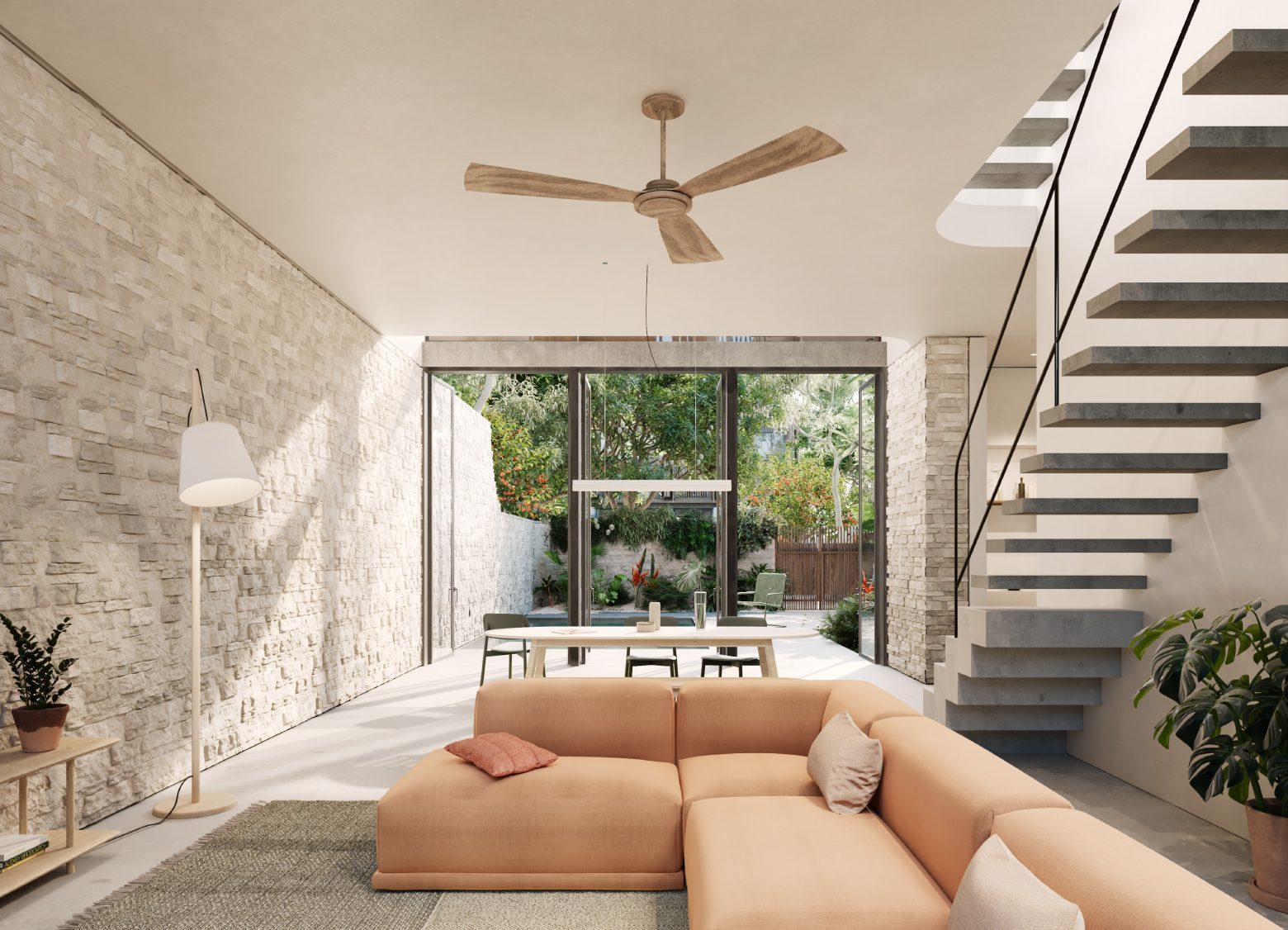 Kin Villas interior living space with stone wall and open garden